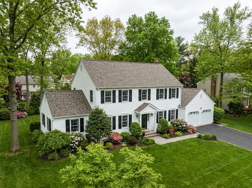 Two-story center-hall Colonial with a new shingle roof